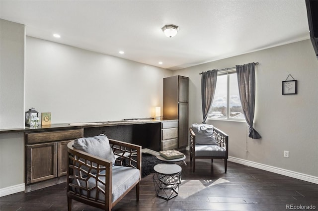 living area with recessed lighting, baseboards, and dark wood finished floors