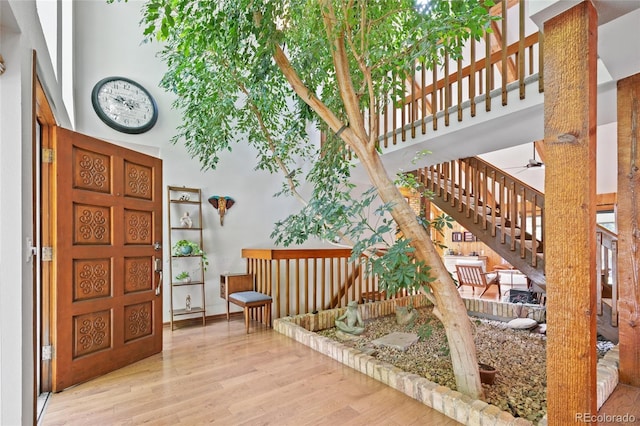 10886 E Crestline Cir, Englewood, CO 80111 - entrance foyer featuring a towering ceiling, wood finished floors, and stairs