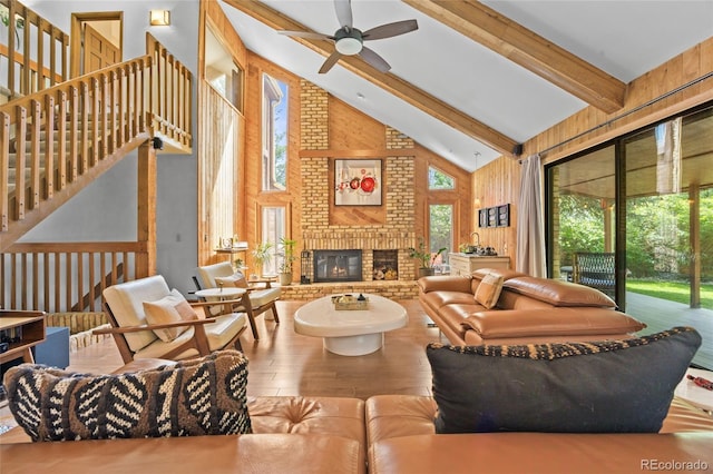 10886 E Crestline Cir, Englewood, CO 80111 - living room featuring hardwood / wood-style floors, high vaulted ceiling, plenty of natural light, beam ceiling, and ceiling fan
