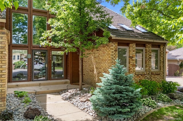 10886 E Crestline Cir, Englewood, CO 80111 - doorway to property with brick siding