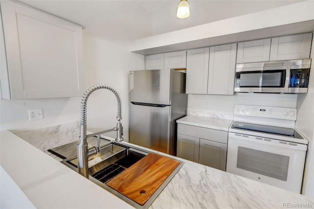 kitchen featuring appliances with stainless steel finishes and sink