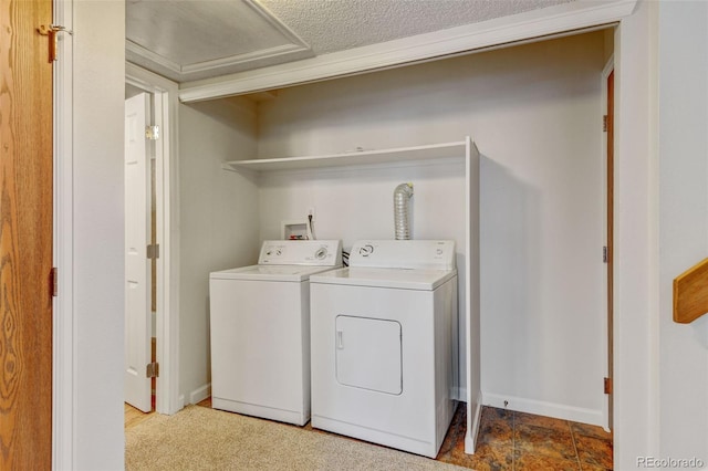 laundry area featuring independent washer and dryer and a textured ceiling