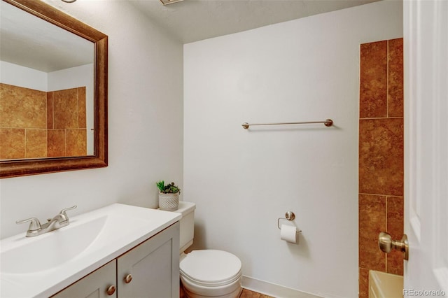 full bathroom featuring vanity, toilet, and tiled shower / bath