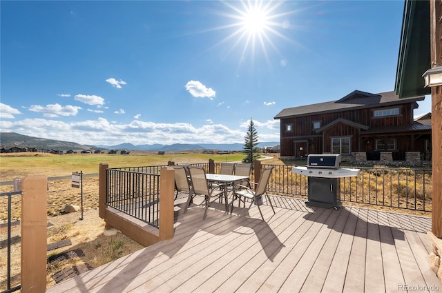 deck featuring a mountain view and area for grilling