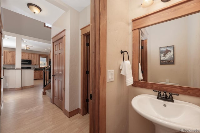 bathroom featuring sink and hardwood / wood-style floors