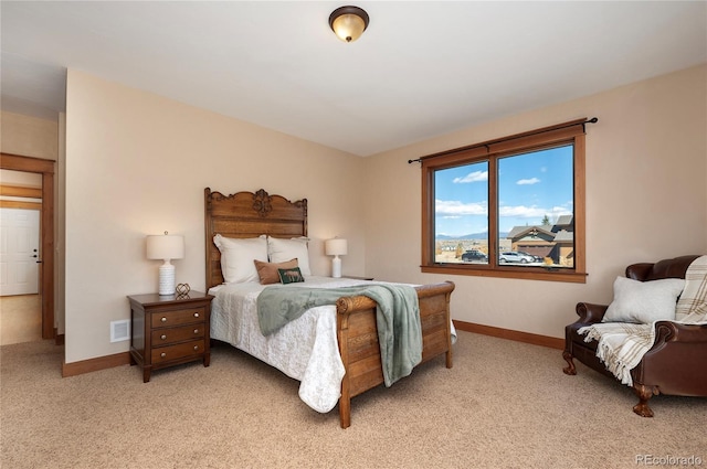 bedroom featuring light colored carpet