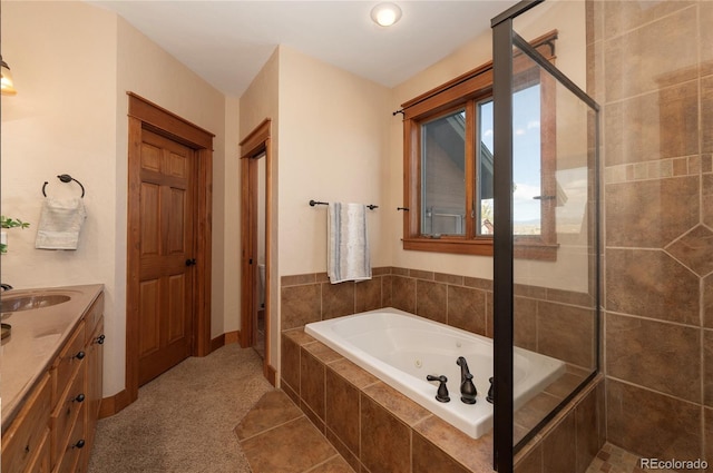 bathroom featuring vanity and shower with separate bathtub