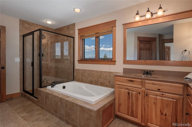 bathroom featuring vanity, independent shower and bath, and tile patterned floors