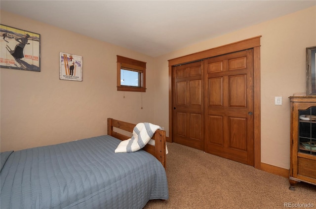 bedroom featuring a closet and carpet floors