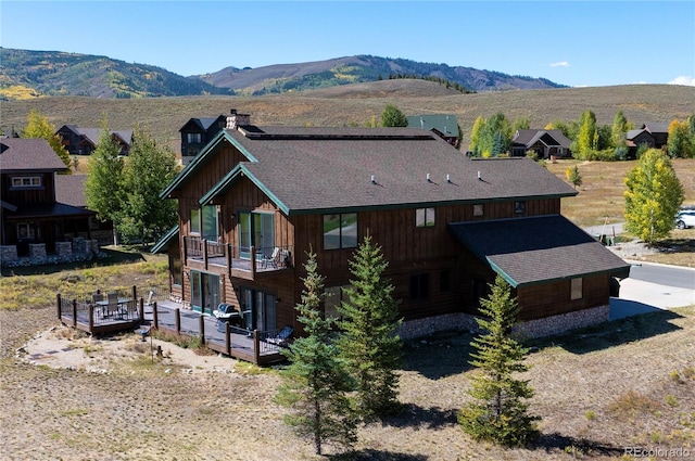 birds eye view of property with a mountain view