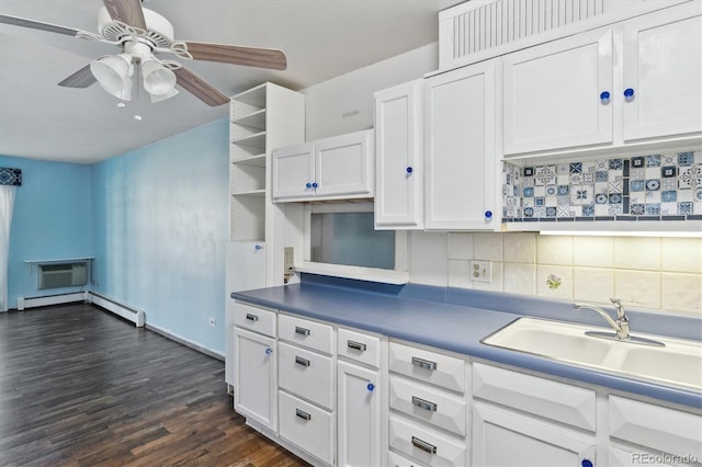 kitchen with white cabinets, dark hardwood / wood-style flooring, an AC wall unit, ceiling fan, and tasteful backsplash