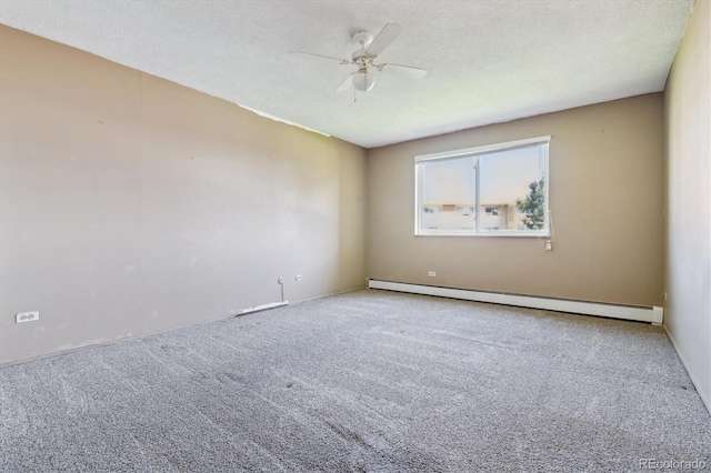 spare room featuring ceiling fan, baseboard heating, carpet, and a textured ceiling