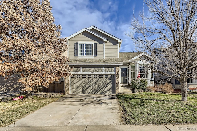 front facade with a front lawn and a garage