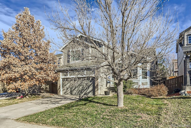 view of front facade featuring a front yard and a garage