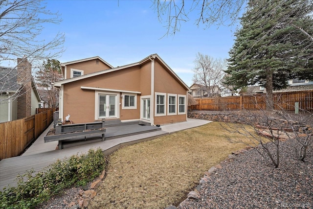 back of house with a patio and a fenced backyard