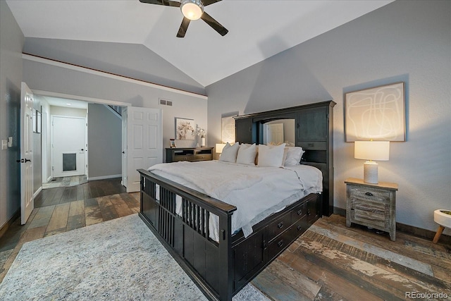 bedroom featuring hardwood / wood-style floors, baseboards, visible vents, ceiling fan, and vaulted ceiling