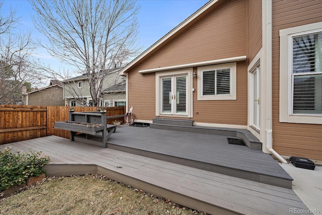 deck featuring entry steps and fence