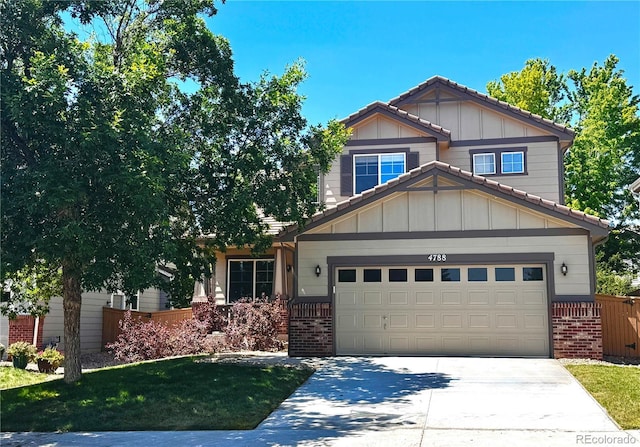 4788 Laurelglen Ln, Highlands Ranch, CO 80130 - craftsman-style house featuring brick siding, board and batten siding, driveway, and a tile roof