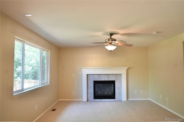 4788 Laurelglen Ln, Highlands Ranch, CO 80130 - unfurnished living room featuring a ceiling fan, carpet flooring, and a tile fireplace