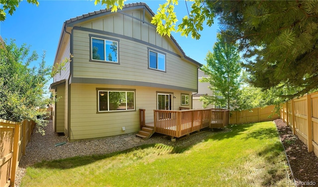 4788 Laurelglen Ln, Highlands Ranch, CO 80130 - rear view of house featuring board and batten siding, a wooden deck, and a fenced backyard