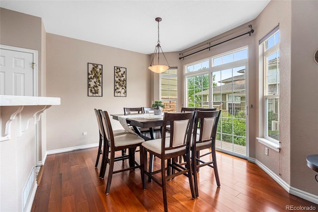 3000 E 112th Ave Unit 86, Northglenn, CO 80233 - dining area with wood finished floors and baseboards