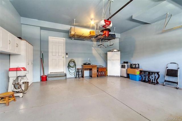 3000 E 112th Ave Unit 86, Northglenn, CO 80233 - garage featuring freestanding refrigerator