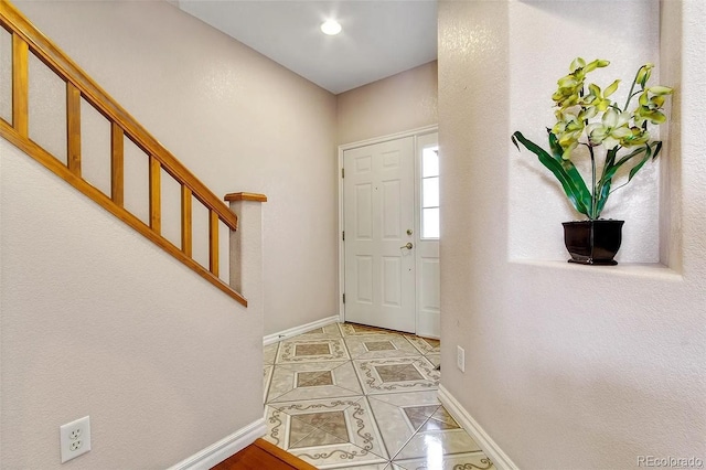 3000 E 112th Ave Unit 86, Northglenn, CO 80233 - entrance foyer with baseboards, tile patterned flooring, and stairway