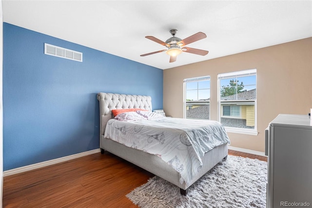 3000 E 112th Ave Unit 86, Northglenn, CO 80233 - bedroom with baseboards, wood finished floors, and a ceiling fan