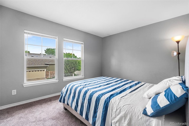 3000 E 112th Ave Unit 86, Northglenn, CO 80233 - bedroom featuring baseboards and carpet flooring