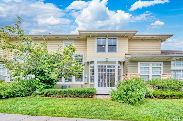 3000 E 112th Ave Unit 86, Northglenn, CO 80233 - view of front of property featuring a front lawn and cooling unit