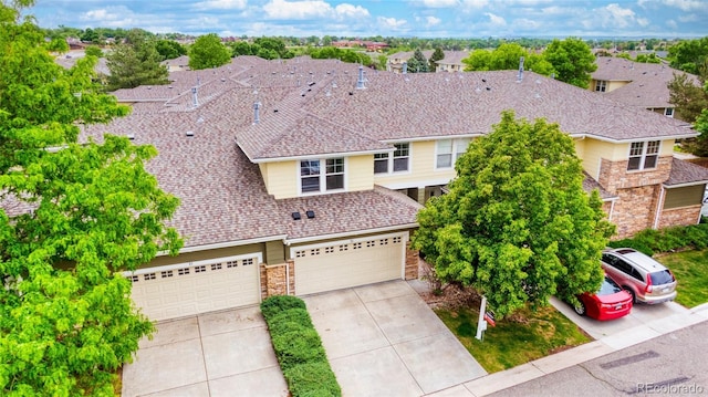 3000 E 112th Ave Unit 86, Northglenn, CO 80233 - traditional-style home featuring concrete driveway and stone siding