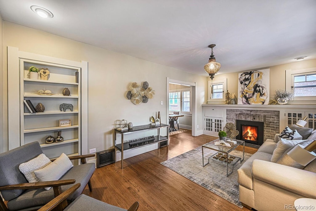 460 S Sherman St, Denver, CO 80209 - living room with visible vents, wood finished floors, and a fireplace