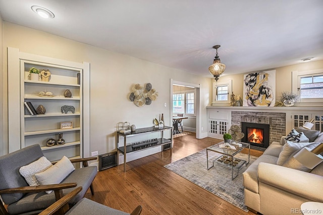460 S Sherman St, Denver, CO 80209 - living room with visible vents, wood finished floors, and a fireplace