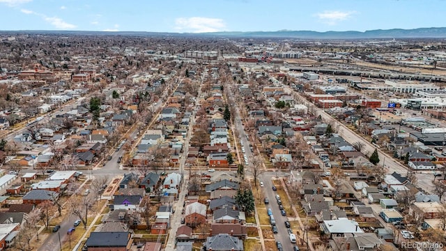 drone / aerial view featuring a residential view and a mountain view