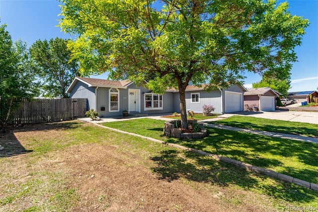 ranch-style house featuring concrete driveway and an attached garage