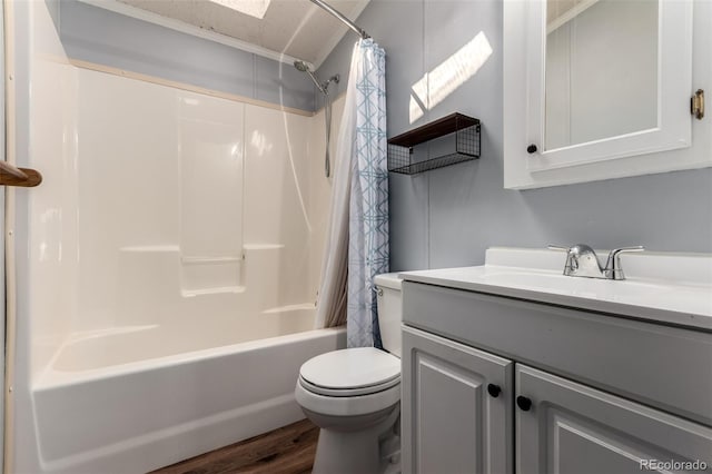full bathroom featuring toilet, wood finished floors, shower / bath combo, and vanity