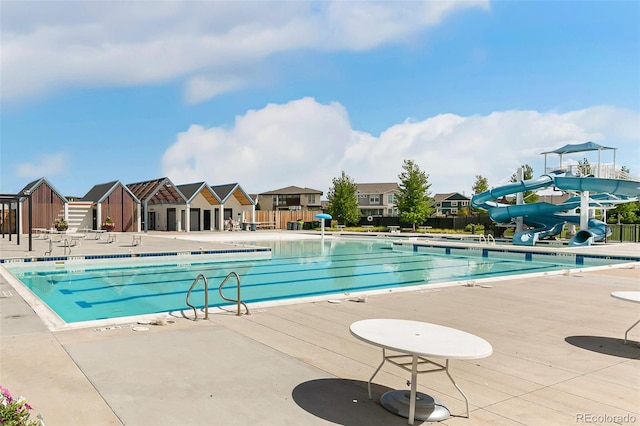 5880 Beeler Ct, Denver, CO 80238 - community pool featuring a water slide, fence, and a patio