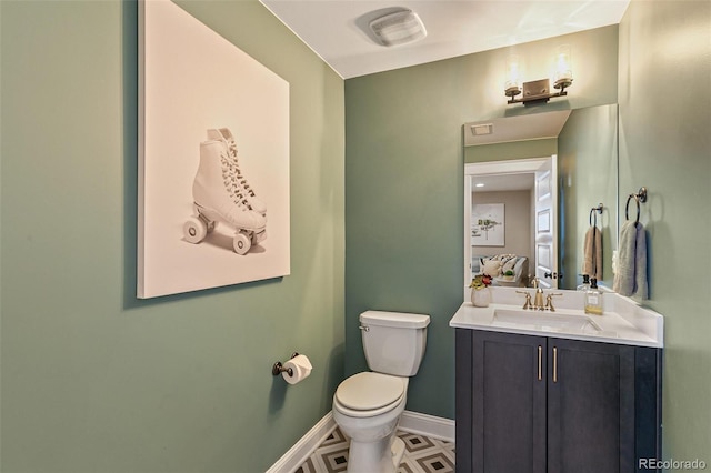5880 Beeler Ct, Denver, CO 80238 - half bathroom featuring toilet, baseboards, and vanity
