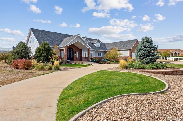 29850 E 167th Pl, Brighton, CO 80603 - view of front of house with brick siding and a front lawn