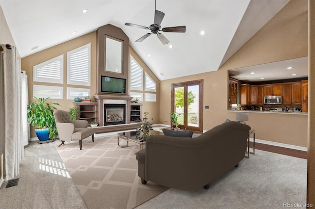 29850 E 167th Pl, Brighton, CO 80603 - living area with a glass covered fireplace, high vaulted ceiling, ceiling fan, recessed lighting, and baseboards
