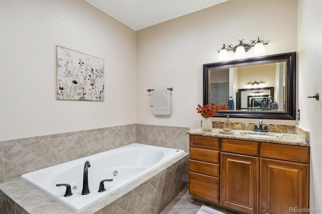 bathroom with vanity and tiled bath