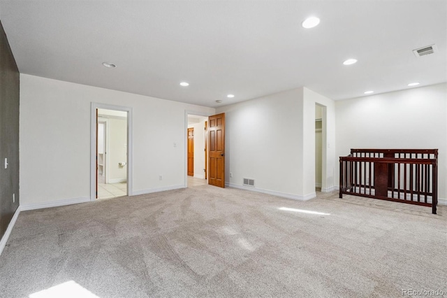 29850 E 167th Pl, Brighton, CO 80603 - unfurnished bedroom with baseboards, recessed lighting, light carpet, and a spacious closet