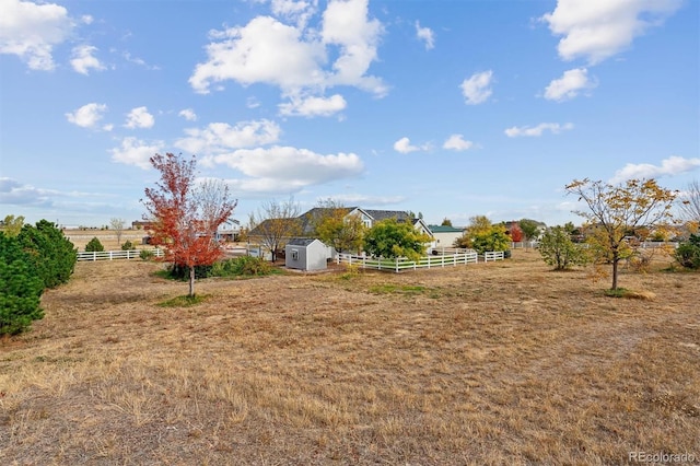 29850 E 167th Pl, Brighton, CO 80603 - view of yard featuring fence, a shed, an outdoor structure, and a view of rural / pastoral area