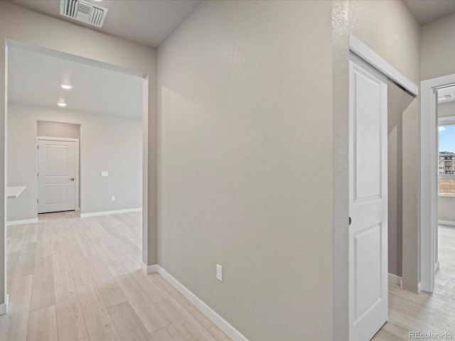 hallway featuring light wood-type flooring