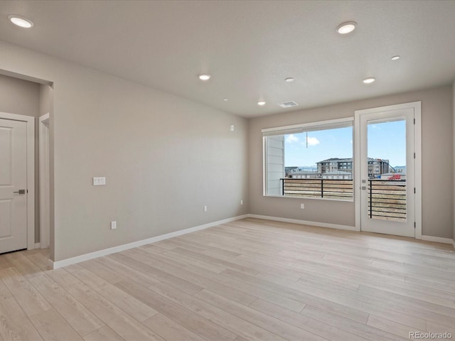 empty room with light wood-type flooring