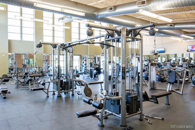 gym with a towering ceiling