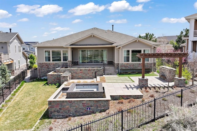 27381 E Lakeview Dr, Aurora, CO 80016 - back of house featuring a patio, stone siding, an outdoor hot tub, a pergola, and roof with shingles