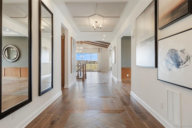 27381 E Lakeview Dr, Aurora, CO 80016 - hallway featuring a chandelier, dark wood finished floors, and baseboards