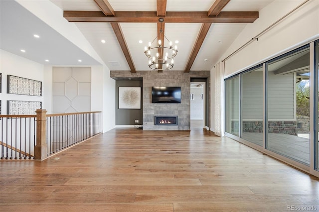 27381 E Lakeview Dr, Aurora, CO 80016 - unfurnished living room featuring a chandelier, light wood-type flooring, recessed lighting, and a tiled fireplace