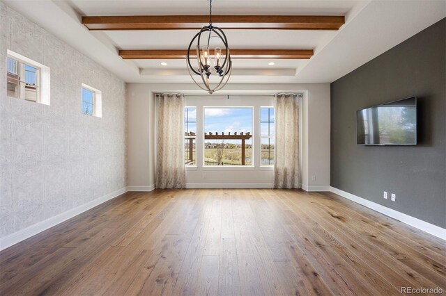 27381 E Lakeview Dr, Aurora, CO 80016 - unfurnished room featuring healthy amount of natural light, a chandelier, wood-type flooring, baseboards, and beamed ceiling